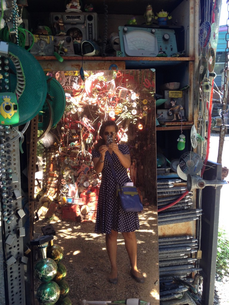 Alison Stewarts snaps a mirror-shot at the Cathedral of Junk in Austin, TX.